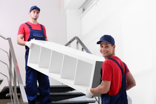 Professional movers packing items securely