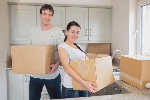 Expert moving professionals carefully packing fragile items